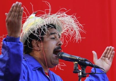 Venezuela's acting President and presidential candidate Maduro wears a hat with a bird on it as he speaks during a campaign rally in Vargas