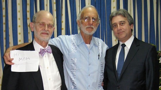 Jailed American Alan Gross, center,  poses for a photo with Rabbi Elie Abadie, right, and U.S. lawyer James L.Berenthal