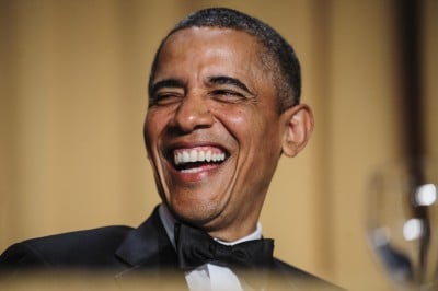 U.S. President Barack Obama laughs during the White House Correspondents' Association (WHCA) dinner in Washington, District of Columbia, U.S., on Saturday, April 27, 2013. The 99th annual dinner raises money for WHCA scholarships and honors the recipients of the organization's journalism awards. Photographer: Pete Marovich/Bloomberg via Getty Images