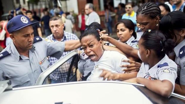 A member of the opposition movement Ladies in White is arrested during a demonstration on International Human Rights Day in December 2015.